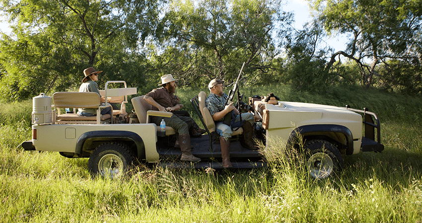 hunting party in open air truck