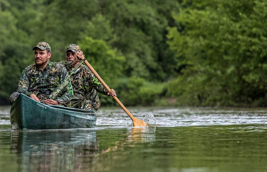 Hunters in a canoe