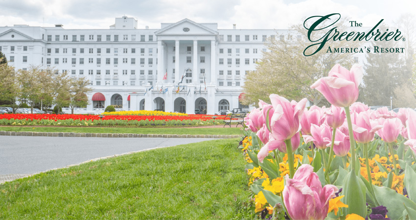 front of the Greenbrier Resort building with tulips in foreground