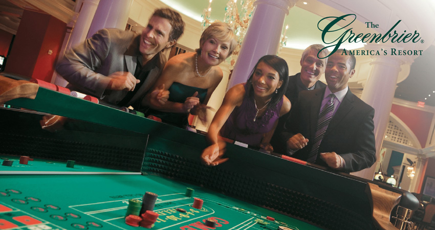 5 people gathered around a casino table