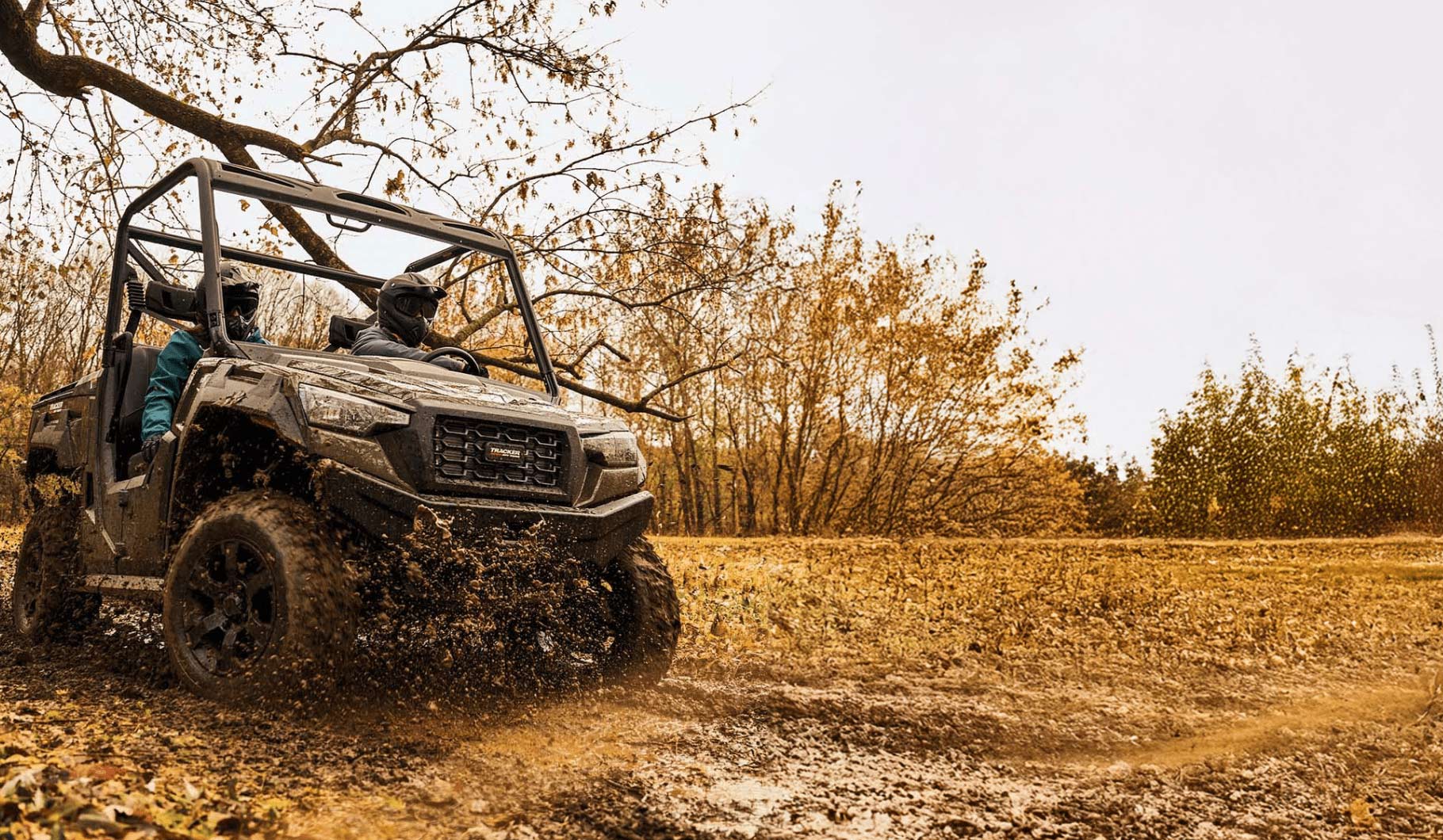Bass Pro Shops Tracker 800SX LE driving through mud
